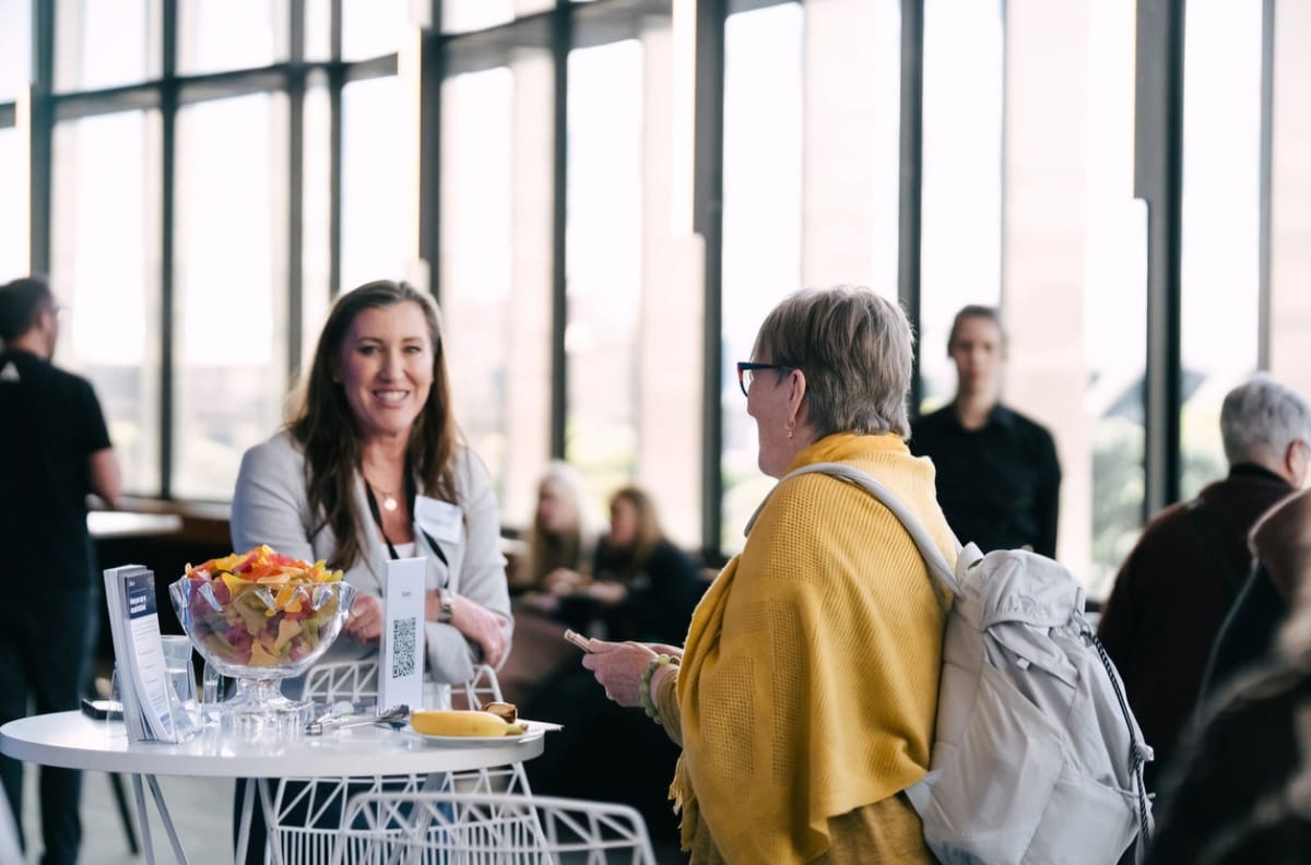 Conversations at the Surely stand at the PMAANZ 2026 conference in Wellington